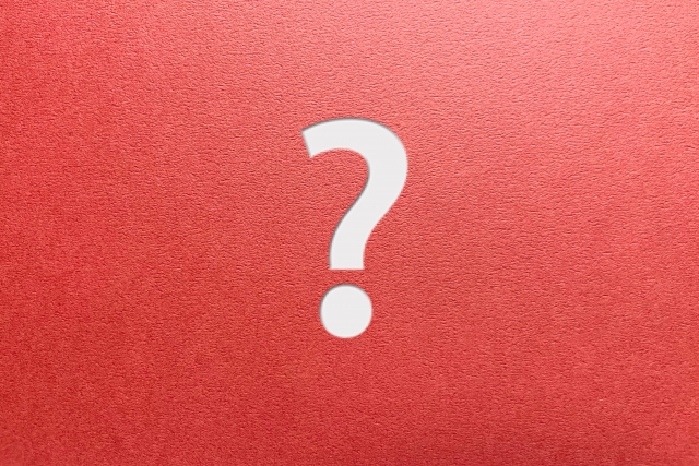 赤い背景のクエスチョンマークの画像